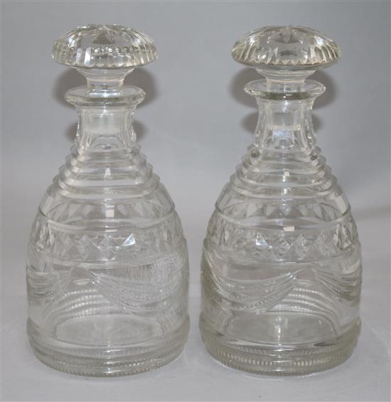 A pair of Regency Irish cut glass mallet form decanters and stoppers, height 25cm